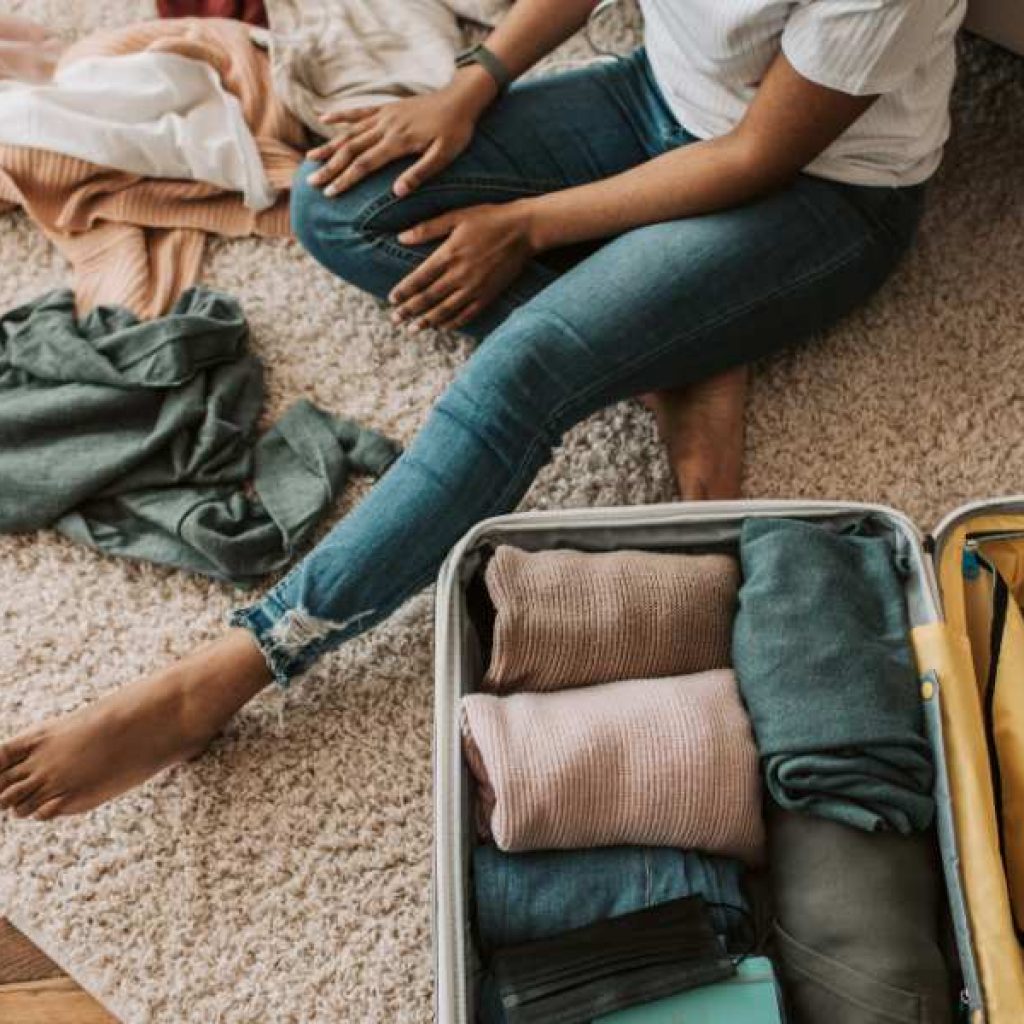 Sri Lanka packing list essentials laid out on bed including lightweight clothes and travel gear