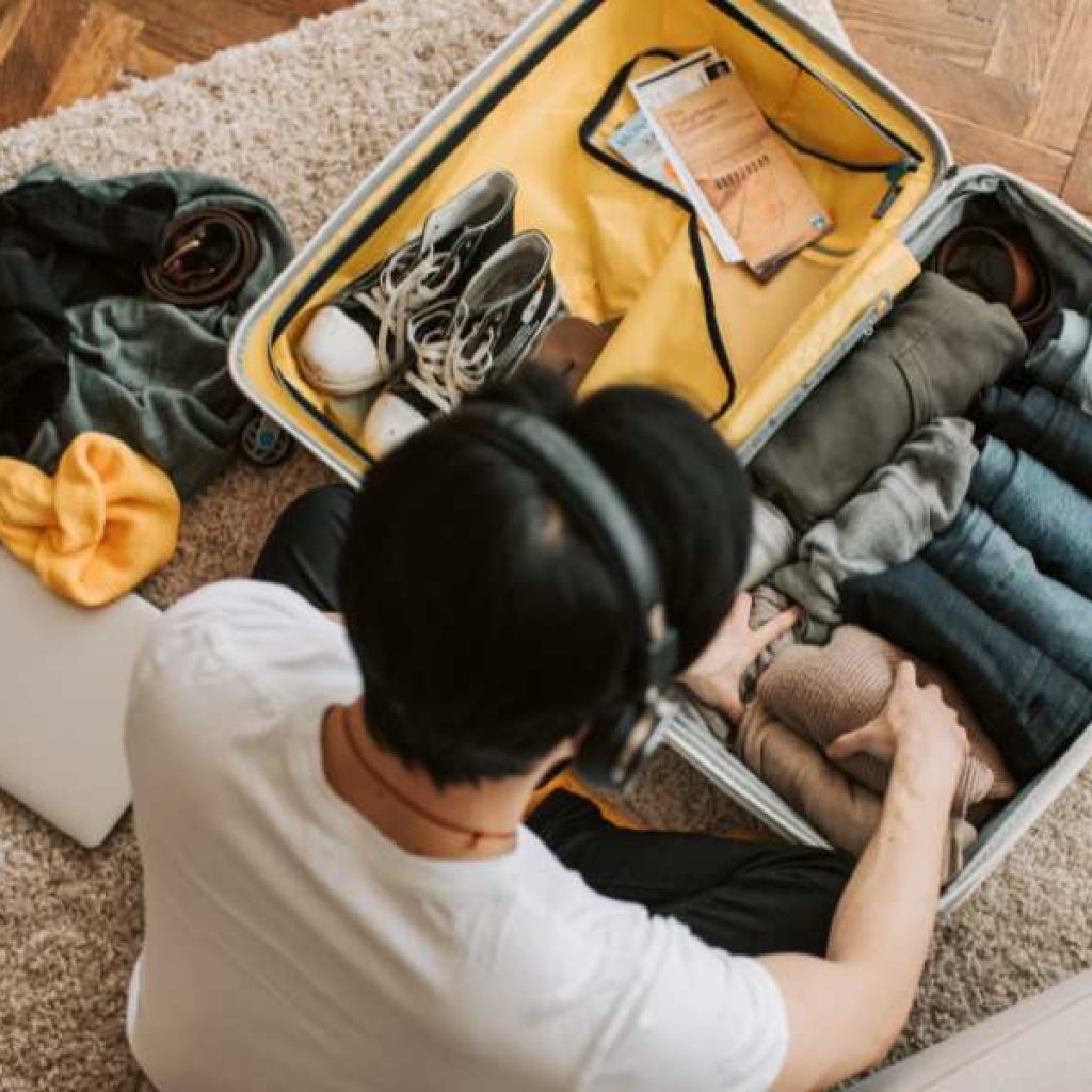 Sri Lanka packing list essentials laid out on bed including lightweight clothes and travel gear