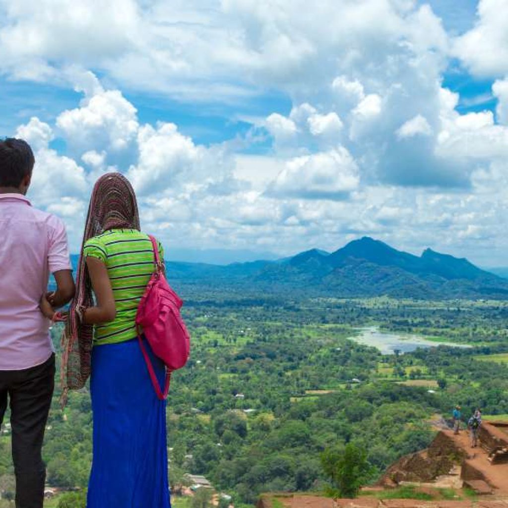 Newlyweds exploring ancient Sigiriya Rock Fortress on romantic Sri Lanka honeymoon