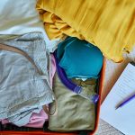 Sri Lanka packing list essentials laid out on bed including lightweight clothes and travel gear