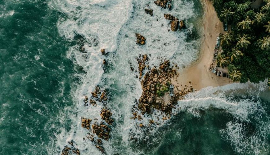 "Budget traveler counting Sri Lankan rupees with local market scene background
